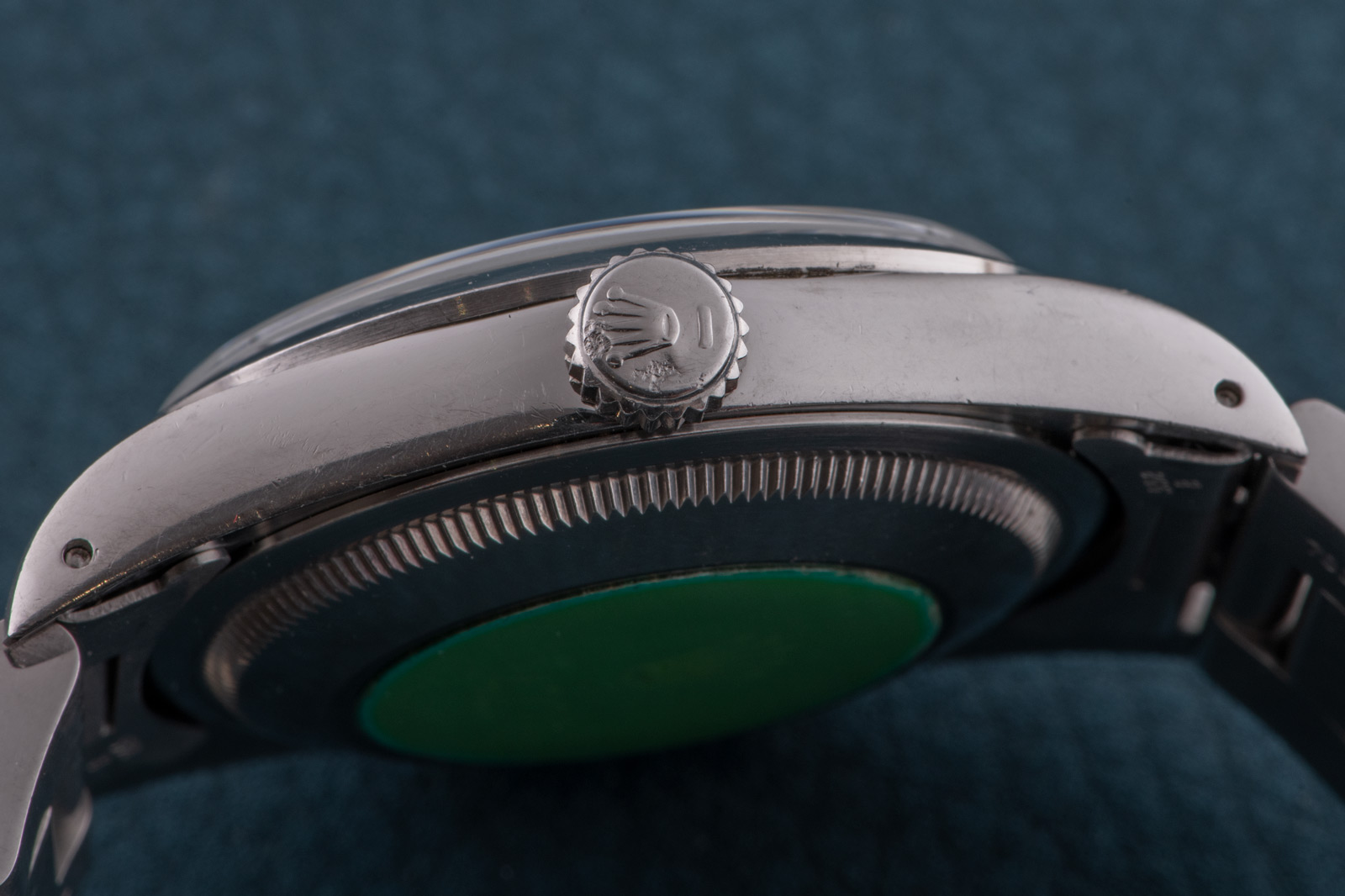 green sticker on back of rolex watch